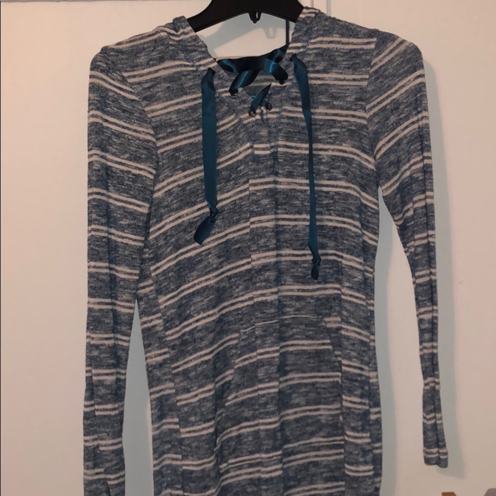 green and white shirt with strings